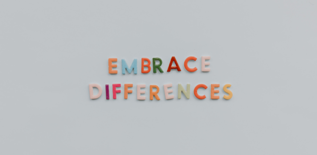 a close-up of colorful letters saying Embrace Differences representing the challenges and understanding of Autism