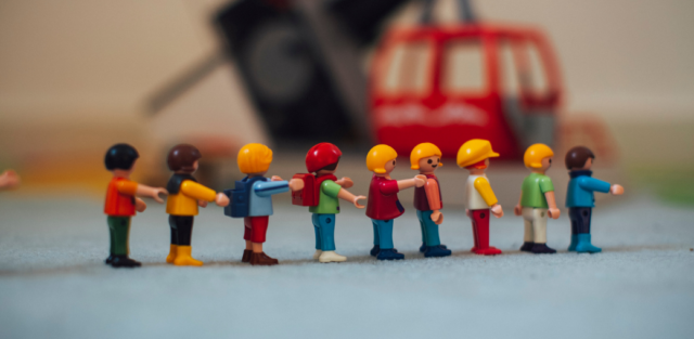 A group of colorful plastic toy people representing tools often used in therapeutic settings to help children with emotional dysregulation autism explore social interactions and emotions. Ea schools. Ohio