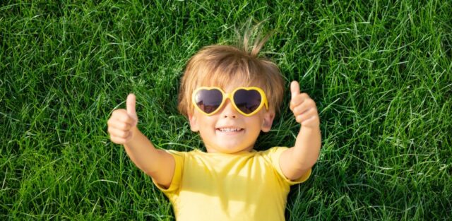 Smiling child with heart-shaped sunglasses giving thumbs up, representing a positive outcome after navigating the special education referral process. Education alternatives, Ohio