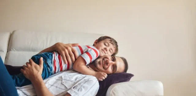 a father calming down his child after a meltdown.