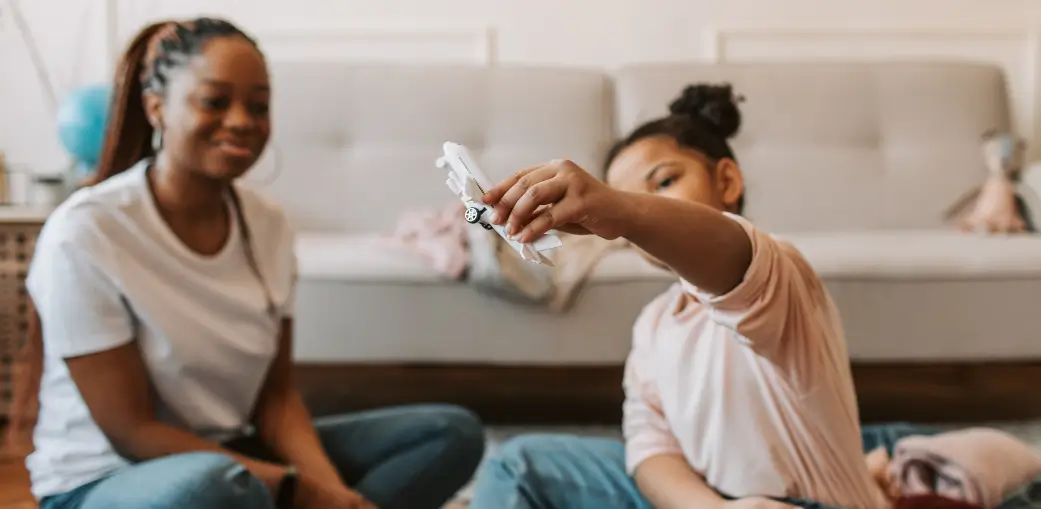 Parent and child interacting at home, representing preparation and support before an IEP meeting. EA Schools Ohio